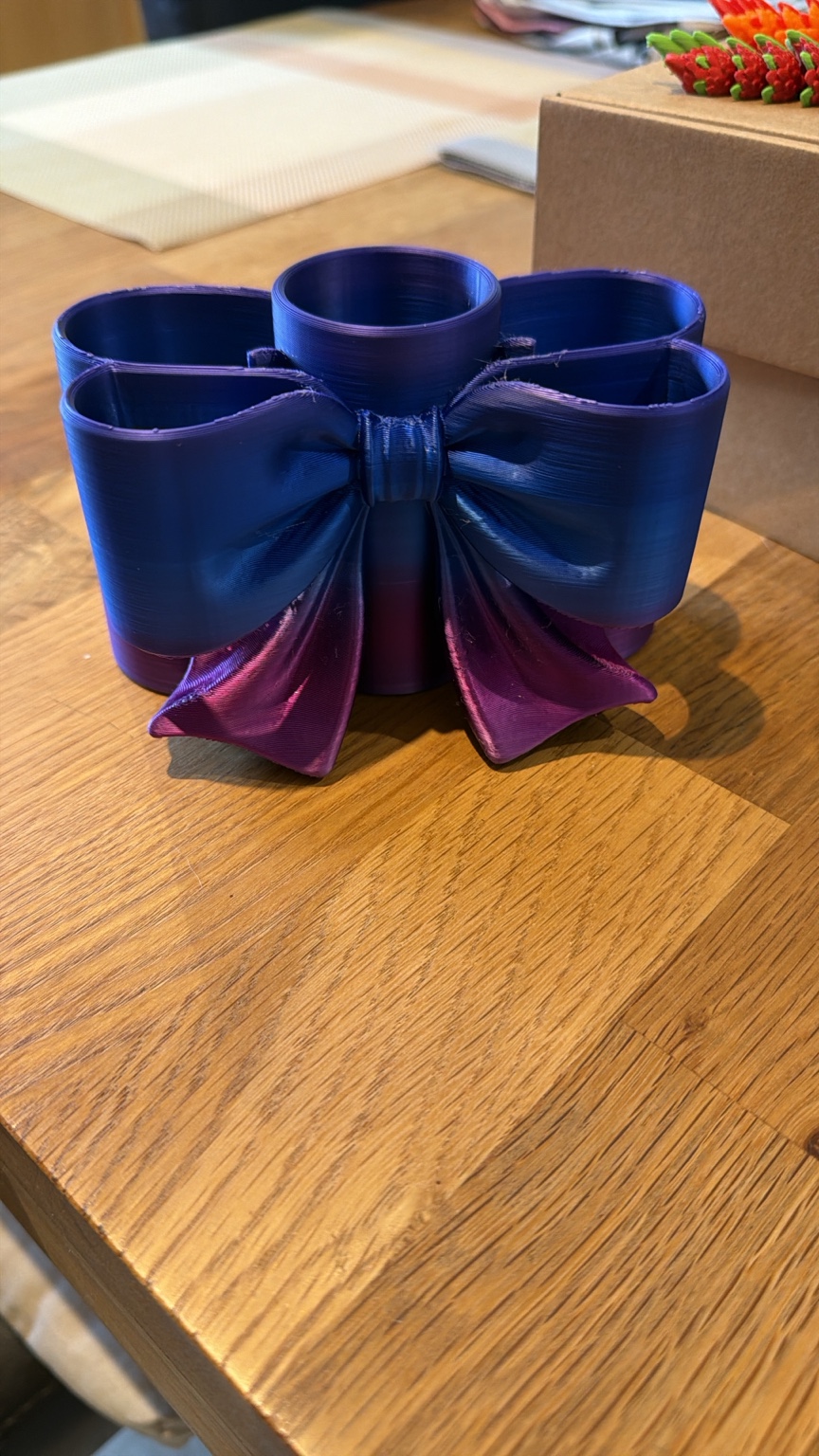 All tied up: A colourful bow-shaped organiser for little bits and pieces.