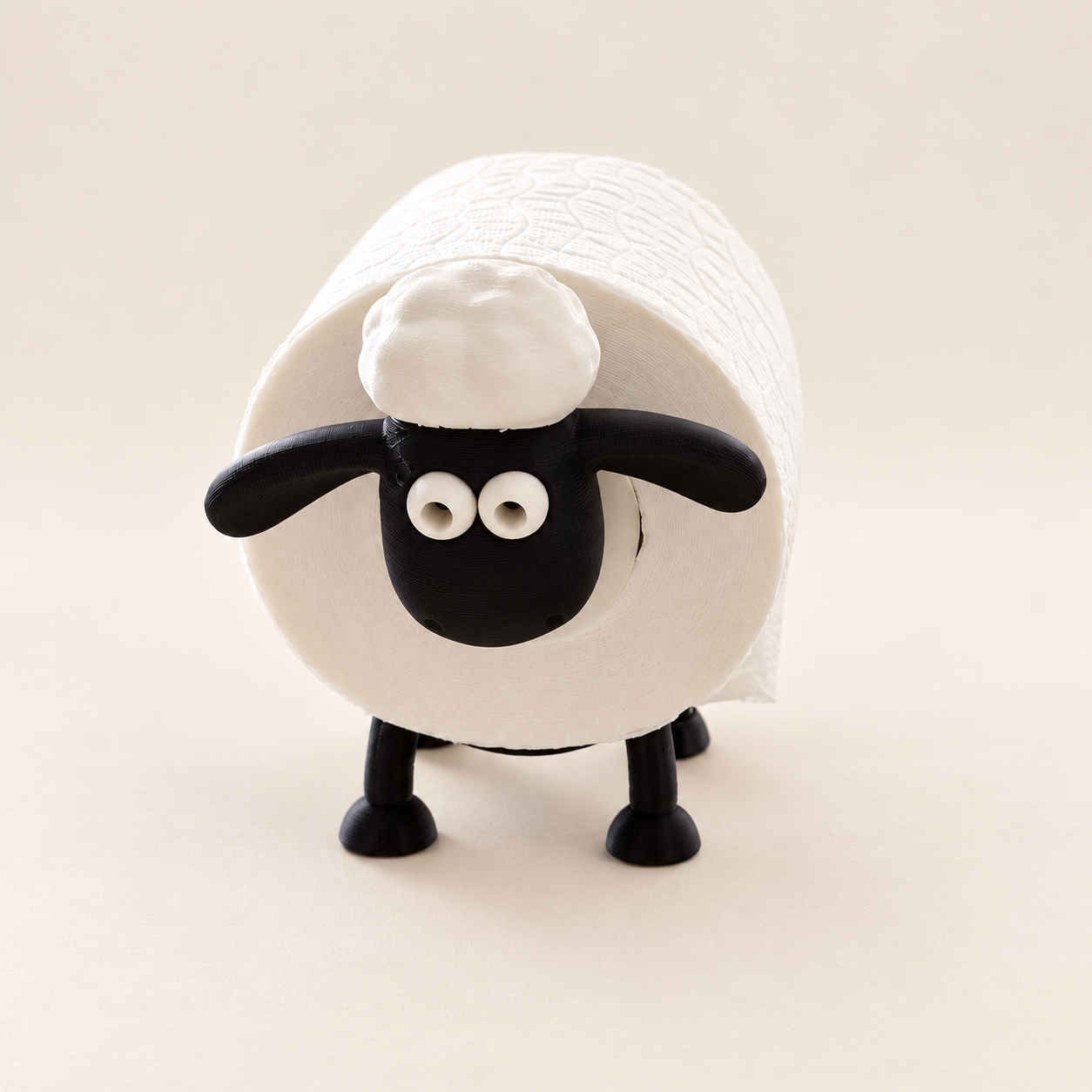 A sheep-shaped roll holder with a full head and tail, a cheeky face and little feet.